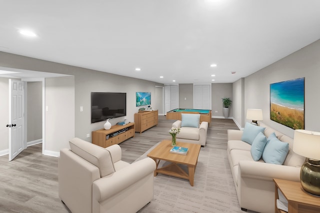 living room featuring light hardwood / wood-style floors and billiards