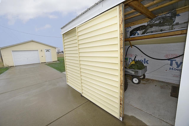 exterior space featuring a garage and an outdoor structure