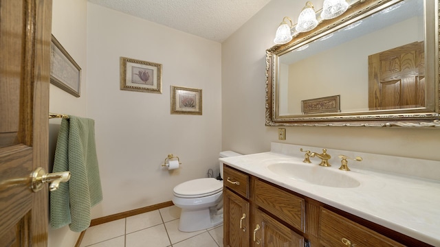 2239 Pine Bluff Dr, Dixon, IL 61021 - half bathroom with toilet, tile patterned flooring, vanity, a textured ceiling, and baseboards