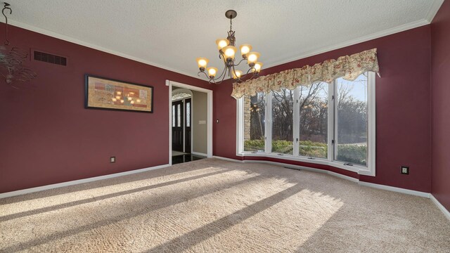 2239 Pine Bluff Dr, Dixon, IL 61021 - carpeted empty room with a chandelier, a textured ceiling, crown molding, and baseboards