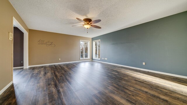 2239 Pine Bluff Dr, Dixon, IL 61021 - unfurnished room with a ceiling fan, dark wood-type flooring, a textured ceiling, and baseboards