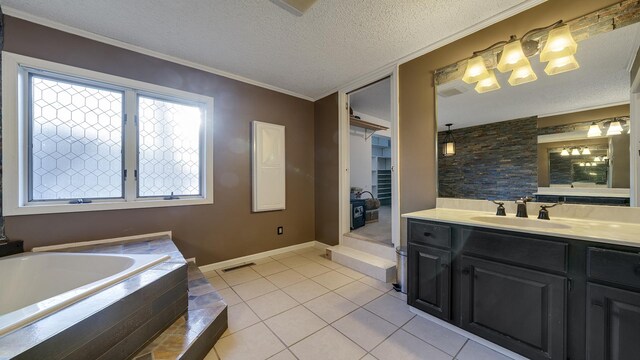 2239 Pine Bluff Dr, Dixon, IL 61021 - full bath with tile patterned floors, vanity, a garden tub, a textured ceiling, and baseboards