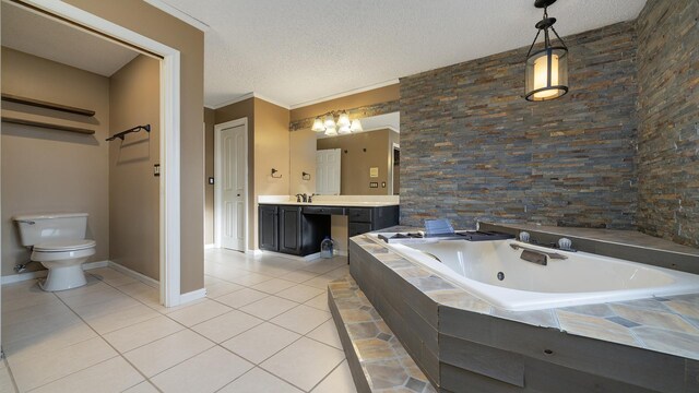 2239 Pine Bluff Dr, Dixon, IL 61021 - bathroom featuring tile patterned floors, a tub with jets, a textured ceiling, toilet, and baseboards