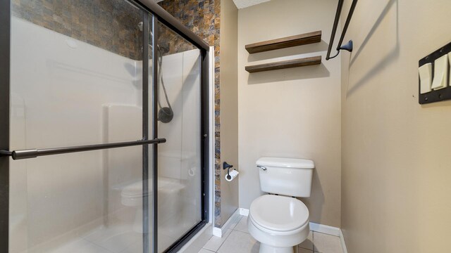 2239 Pine Bluff Dr, Dixon, IL 61021 - bathroom with toilet, a shower stall, baseboards, and tile patterned flooring