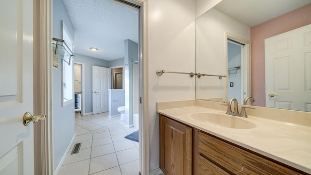 2239 Pine Bluff Dr, Dixon, IL 61021 - bathroom featuring tile patterned floors, vanity, toilet, and baseboards