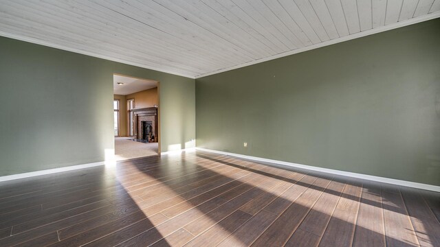 2239 Pine Bluff Dr, Dixon, IL 61021 - empty room featuring wood finished floors, ornamental molding, baseboards, a fireplace, and wooden ceiling