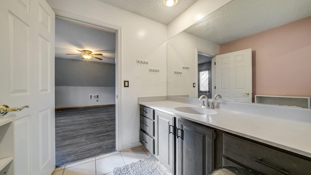 2239 Pine Bluff Dr, Dixon, IL 61021 - bathroom with a textured ceiling, ceiling fan, tile patterned floors, and vanity