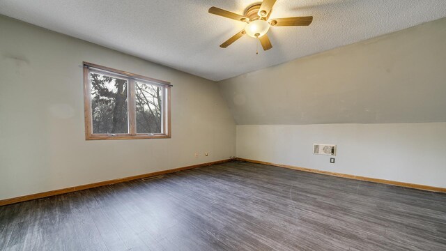 2239 Pine Bluff Dr, Dixon, IL 61021 - additional living space with wood finished floors, a textured ceiling, ceiling fan, baseboards, and vaulted ceiling