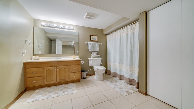 2239 Pine Bluff Dr, Dixon, IL 61021 - bathroom featuring toilet, tile patterned floors, vanity, baseboards, and a shower with shower curtain