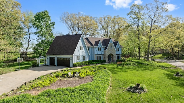 2239 Pine Bluff Dr, Dixon, IL 61021 - tudor-style house featuring a front lawn, driveway, and a garage