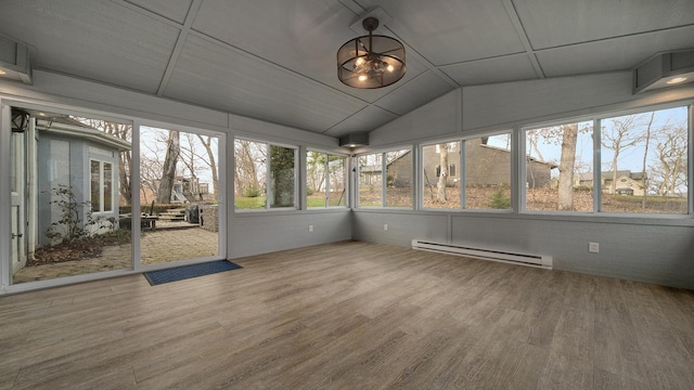 unfurnished sunroom featuring vaulted ceiling and a baseboard radiator