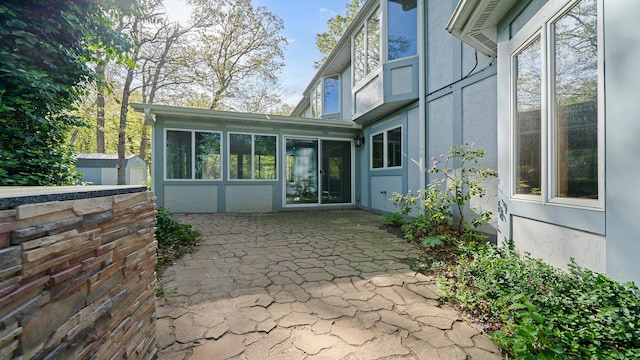 2239 Pine Bluff Dr, Dixon, IL 61021 - view of patio featuring a storage unit and an outdoor structure