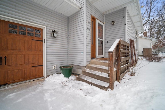 view of snow covered property entrance