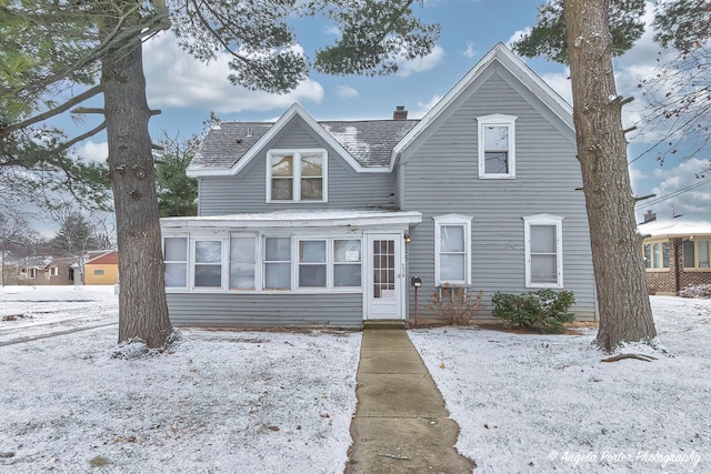 front of property featuring a sunroom