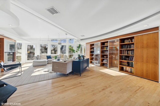 living room with light hardwood / wood-style flooring