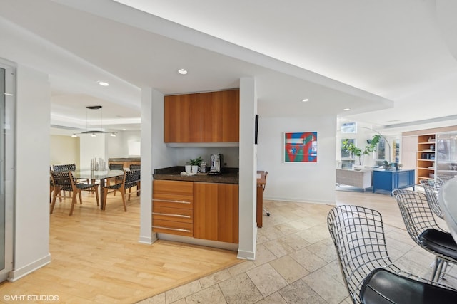 kitchen featuring a tray ceiling