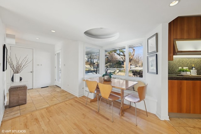 dining space featuring light hardwood / wood-style floors