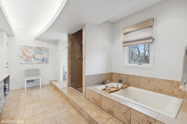 bathroom featuring plus walk in shower and vanity