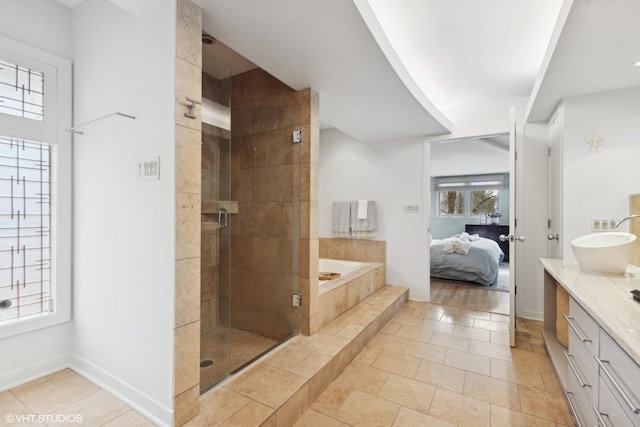 bathroom with shower with separate bathtub, vanity, and tile patterned floors