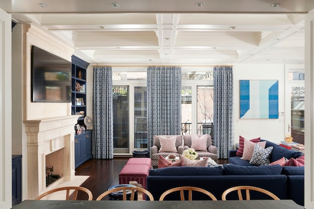 living room with coffered ceiling, beamed ceiling, dark wood-style flooring, and a healthy amount of sunlight