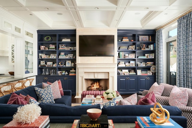 living room with coffered ceiling, beamed ceiling, and ornamental molding