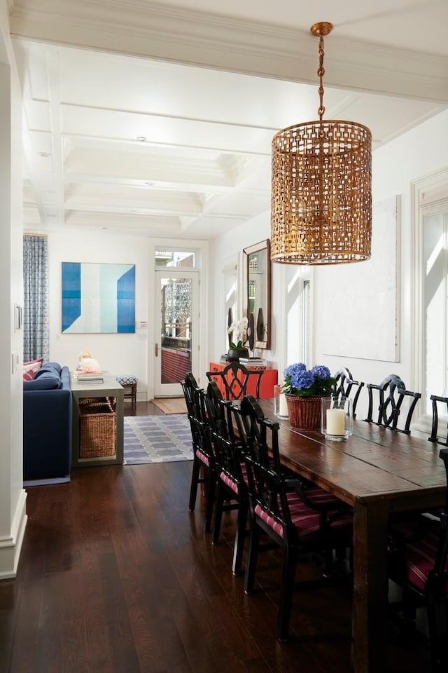 dining area with coffered ceiling, beamed ceiling, hardwood / wood-style floors, and baseboards