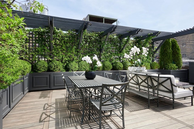 deck with outdoor lounge area and a pergola