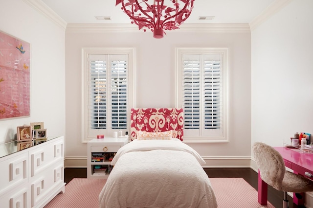 bedroom featuring baseboards, ornamental molding, visible vents, and dark wood-type flooring
