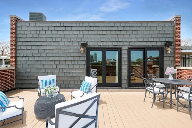 wooden deck featuring central AC and french doors