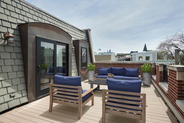wooden terrace featuring an outdoor living space