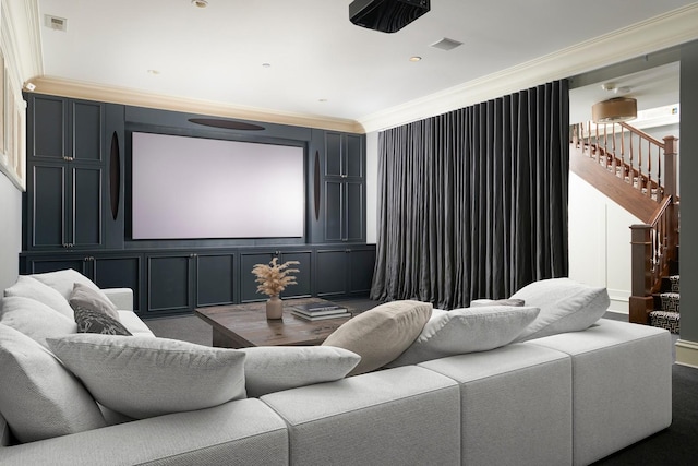home theater room featuring crown molding and wood finished floors