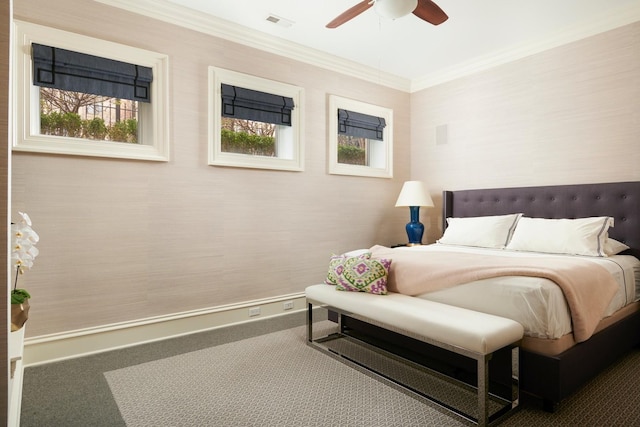 bedroom with ceiling fan, carpet flooring, crown molding, and visible vents