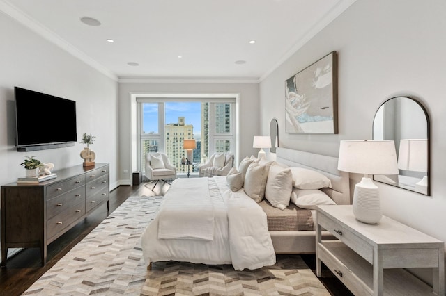 bedroom featuring hardwood / wood-style flooring and crown molding