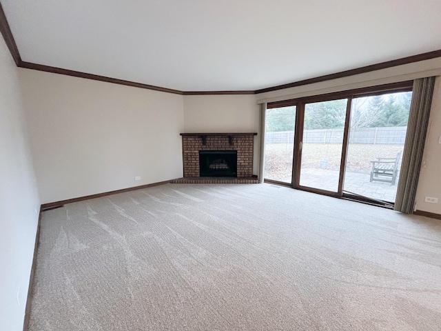 unfurnished living room with a fireplace, crown molding, and light carpet