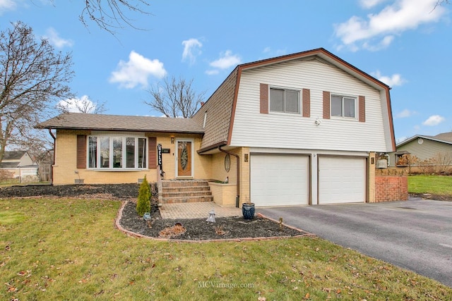 split level home featuring a garage and a front yard