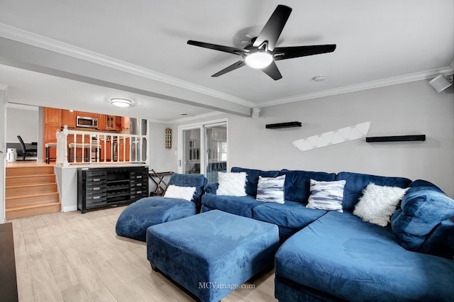 living room with ceiling fan, light hardwood / wood-style floors, and crown molding