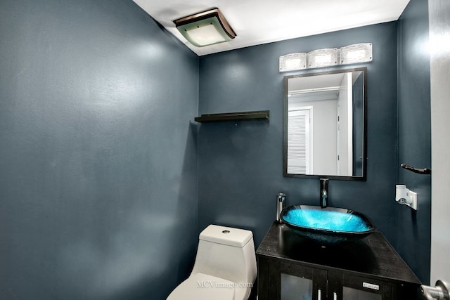 bathroom with vanity and toilet