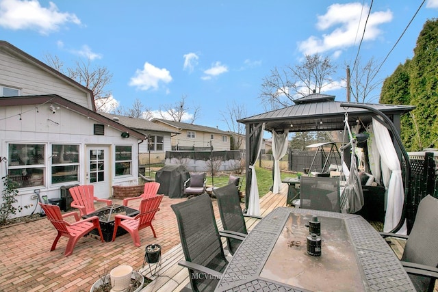 view of patio / terrace with a gazebo, grilling area, and a fire pit