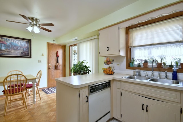 3207 N Pontiac Ave Unit 2S, Chicago, IL 60634 - kitchen featuring white dishwasher, a peninsula, white cabinetry, a ceiling fan, and light countertops