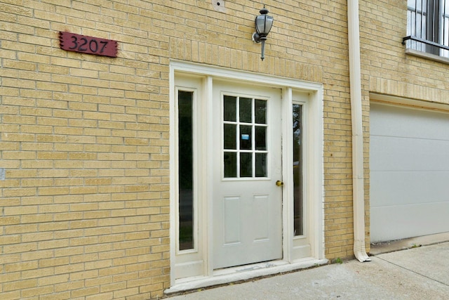 3207 N Pontiac Ave Unit 2S, Chicago, IL 60634 - entrance to property featuring brick siding and a garage