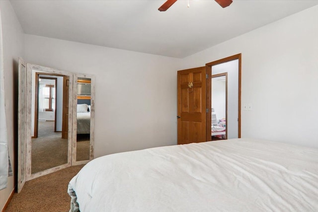 bedroom with carpet flooring, ceiling fan, and a closet