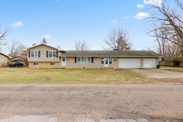 view of front of home with a front lawn and a garage