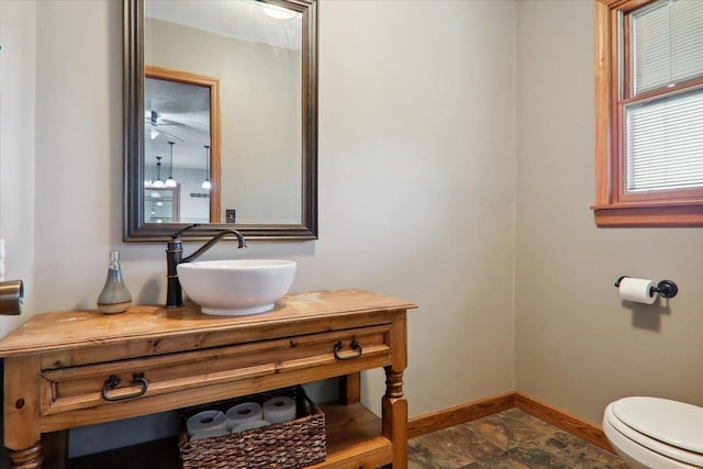 bathroom featuring vanity and toilet