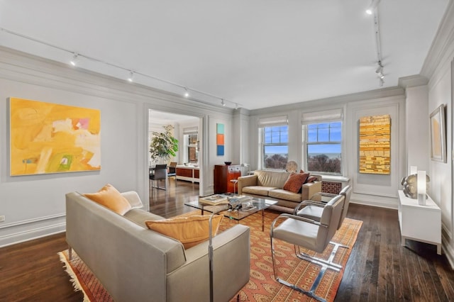 living room with crown molding, track lighting, and wood finished floors