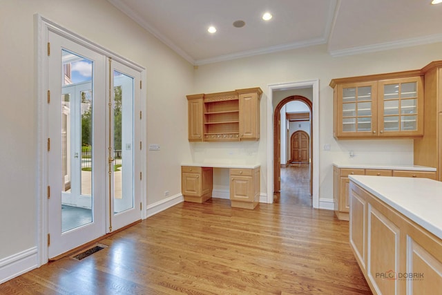 kitchen featuring ornamental molding, light hardwood / wood-style floors, french doors, and light brown cabinetry