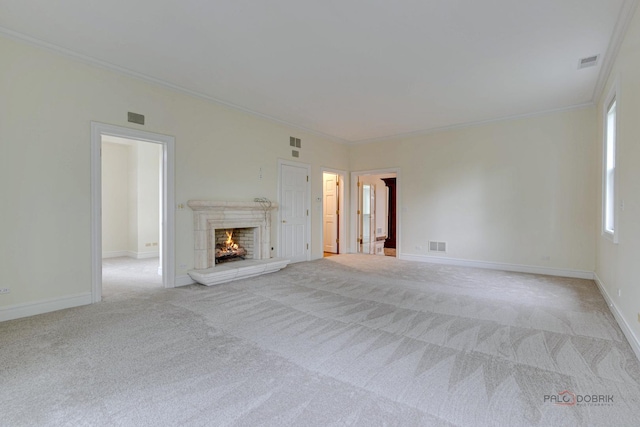 unfurnished living room featuring light colored carpet and ornamental molding