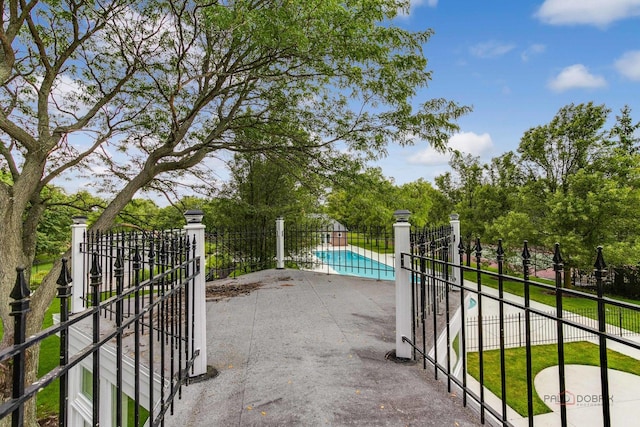 exterior space featuring a fenced in pool