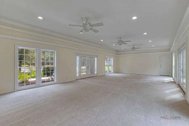 interior space featuring ceiling fan, a healthy amount of sunlight, and ornamental molding