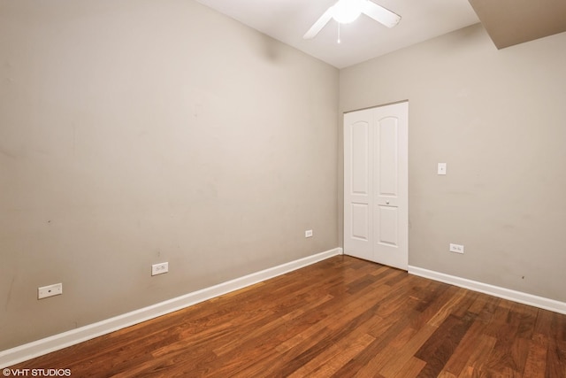 unfurnished room featuring ceiling fan and dark hardwood / wood-style floors