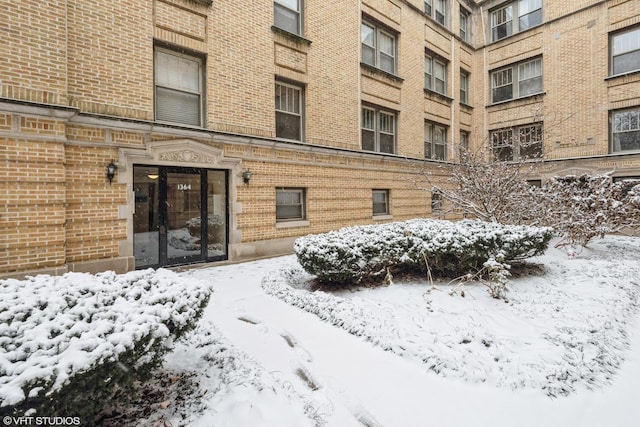 view of snow covered property